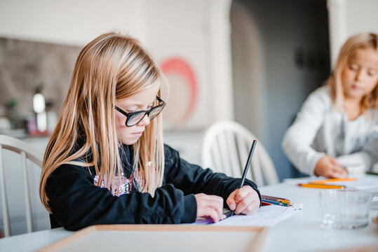Girl at home doing homework