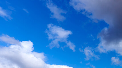 Dark clouds against a blue sky
