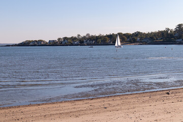 Cummings Park Beach in Stamford Connecticut along Westcott Cove with a Sailboat