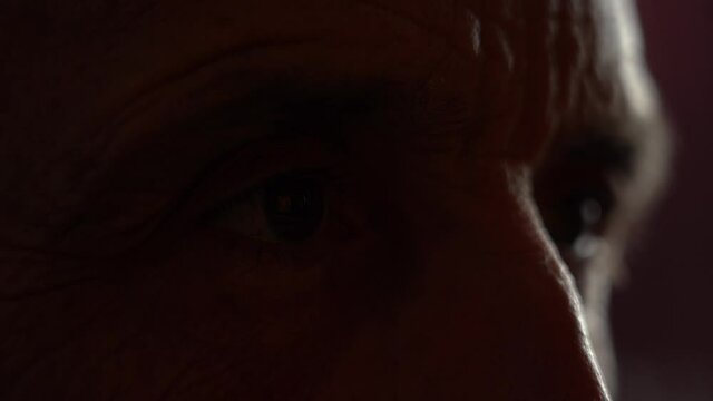 Film Grain. Reflection In The Eyes Of TV News. Senior Eye Close-up, Watching The News. Media Deception. Anxiety Of People.