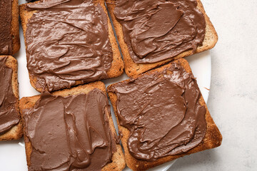 Close up toast with chocolate-nut paste spread top view