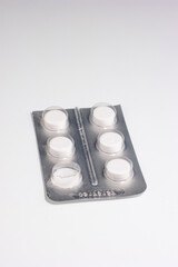 White non descript medicine pills in blister pack top view isolated on white
