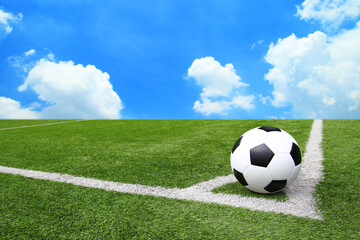 Football and soccer field grass stadium Blue sky background