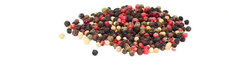 Whole peppercorn mix, peppercorn blend, black, white, pink, and green peppercorn spice mixture isolated on white background.