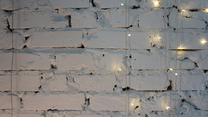 White brick wall with garland