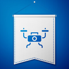 Blue Drone flying icon isolated on blue background. Quadrocopter with video and photo camera symbol. White pennant template. Vector.