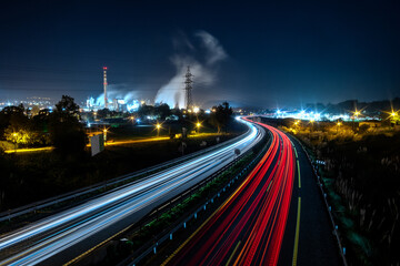 Fototapeta na wymiar Night view of a highway and a factory in Cantabria, Spain