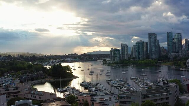 Drone Aerial Shot Over the Vancouver Marina, Moving Closer to the Cityscape on a cloudy day.