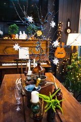 served table in a country house decorated for the Christmas holidays.