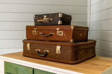Vintage classic outdated trunks luggage, old antique leather suitcases. Travel baggage concept