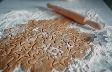 process of making christmas cookies presented by dough from wheat flour 