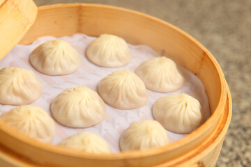 Chinese dumpling in a bamboo steamer