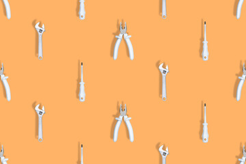 Background made of tools, pliers, screwdriver, wrench. Tools seamless pattern.
