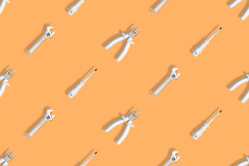 Background made of tools, pliers, screwdriver, wrench. Tools seamless pattern.