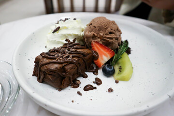 brownie , chocolate ice cream with whipping cream