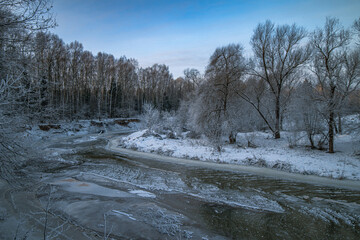 Frosty morning on a frozen river in the clouds of the Moscow region