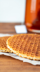 Traditional local signature authentic Dutch Netherlands sweet fresh homemade of delicious tasty stack brown golden waffle caramel honey sugar syrup for dessert in cafe with coffee tea call Stroopwafel