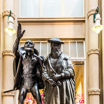 Sculpture of Mephistopheles bewitching the students in the scene Auerbachs Keller from Faust at the entrance of Auerbachs Keller pub in Leipzig