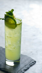 Mojito Cocktail. Alcoholic Drinks made with gin, vodka, rum or whiskey mixed with soda water, fruit juices and garnishes with limes and cherries. Classic American bar drinks.