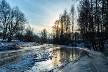 Frosty morning on a frozen river in the clouds of the Moscow region