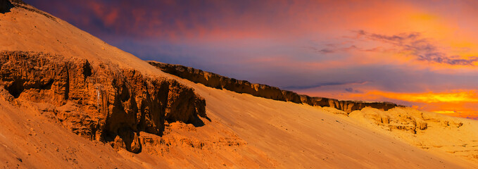 closeup sandy desert dune on the dramatic sunset background, natural outdoor scene