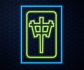 Glowing neon line Mahjong pieces icon isolated on brick wall background. Chinese mahjong red dragon game emoji.  Vector.