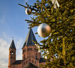focus is on a christmas tree in the front, in the background is blurred the St. Martins cathedral...