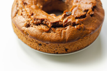 Freshly made spiced fruit ring loaf cake  on the white  background
