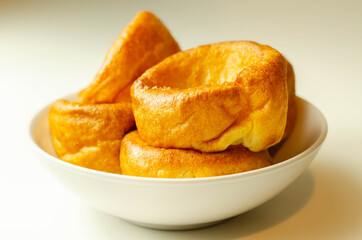 Traditional English Yorkshire pudding, wonderfully crisp and golden baked for a traditional recipe, accompaniment for the perfect Sunday roast