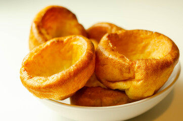 Traditional English Yorkshire pudding, wonderfully crisp and golden baked for a traditional recipe, accompaniment for the perfect Sunday roast