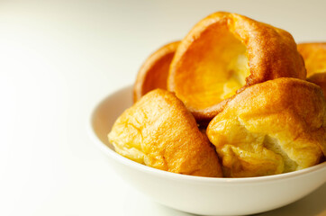 Traditional English Yorkshire pudding, wonderfully crisp and golden baked for a traditional recipe, accompaniment for the perfect Sunday roast