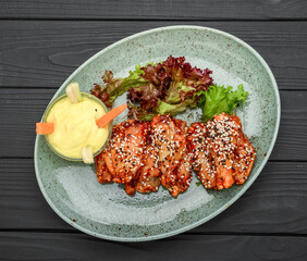 Chicken wings. Traditional asian recipe. Dark background