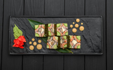 Sushi rolls, nigiri, raw salmon, pickled ginger. Asian food.