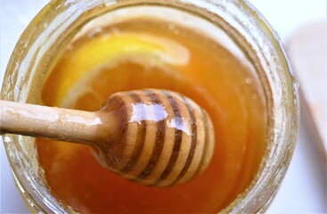Honey with slice of lemon background