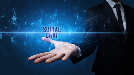 Elegant hand holding SOCIAL CHAT inscription, social networking concept