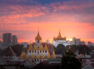 Cityscape of Bangkok Thailand with Wat Ratchanatdaram and Golden Mount view on sunrise background.