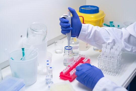 Close-up of scientist pipetting solution