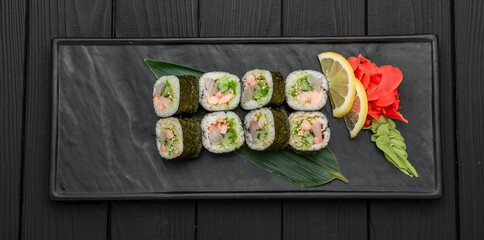 Sushi rolls, nigiri, raw salmon, pickled ginger. Asian food.