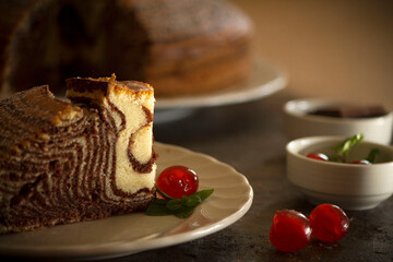 chiffon cake with chocolate and cherries
