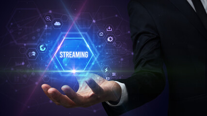 Man hand holding STREAMING inscription, social media concept