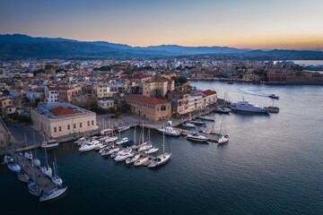 Fototapeta na wymiar Amazing and Picturesque Old Center of Chania Cityscape with Ancient Venetian Port At Blue Hour in Crete, Greece