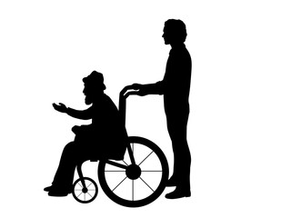 Silhouettes of man walking his grandfather in wheelchair