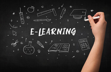 Hand drawing E-LEARNING inscription with white chalk on blackboard, education concept