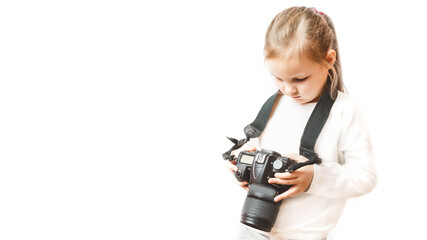 little girl holding a digital professional photo camera. White background. future photographer. Childhood