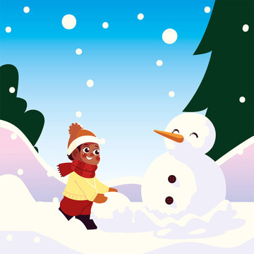 cute little boy with snowball making snowman in winter scene