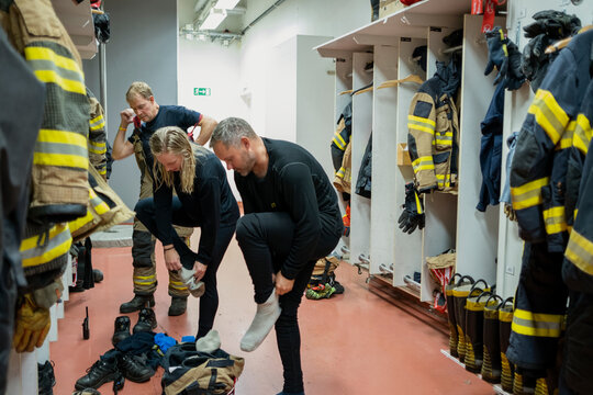 Firefighters changing in locker