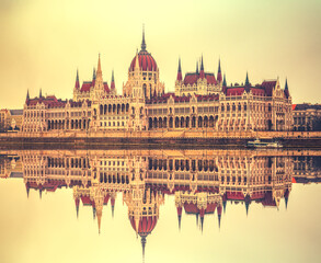 Fototapeta premium Hungarian Parliament with reflection at sunrise. Budapest