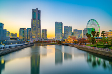 Yokohama city skyline at sunset viewed from the bay