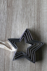 Star shaped cookie cutters on wooden background. Top view.
