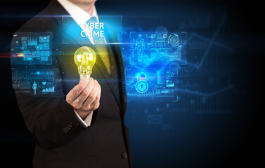Businessman holding lightbulb with CYBER CRIME inscription, online security idea concept
